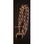 A VICTORIAN 9CT ROSE GOLD ALBERT CHAIN AND FOB With large links and a T bar, the later fob set