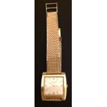 LONGINES, A VINTAGE GENTLEMEN'S 18CT GOLD BRACELET WATCH The square cream dial set with four