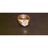 A HALLMARKED 18CT GOLD AND DIAMOND RING The old cut diamond claw set within reeded shoulders (size