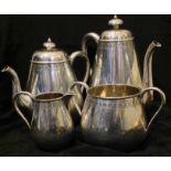 A VICTORIAN HALLMARKED SILVER FOUR PIECE TEA SERVICE To include a bulbous form teapot, having a