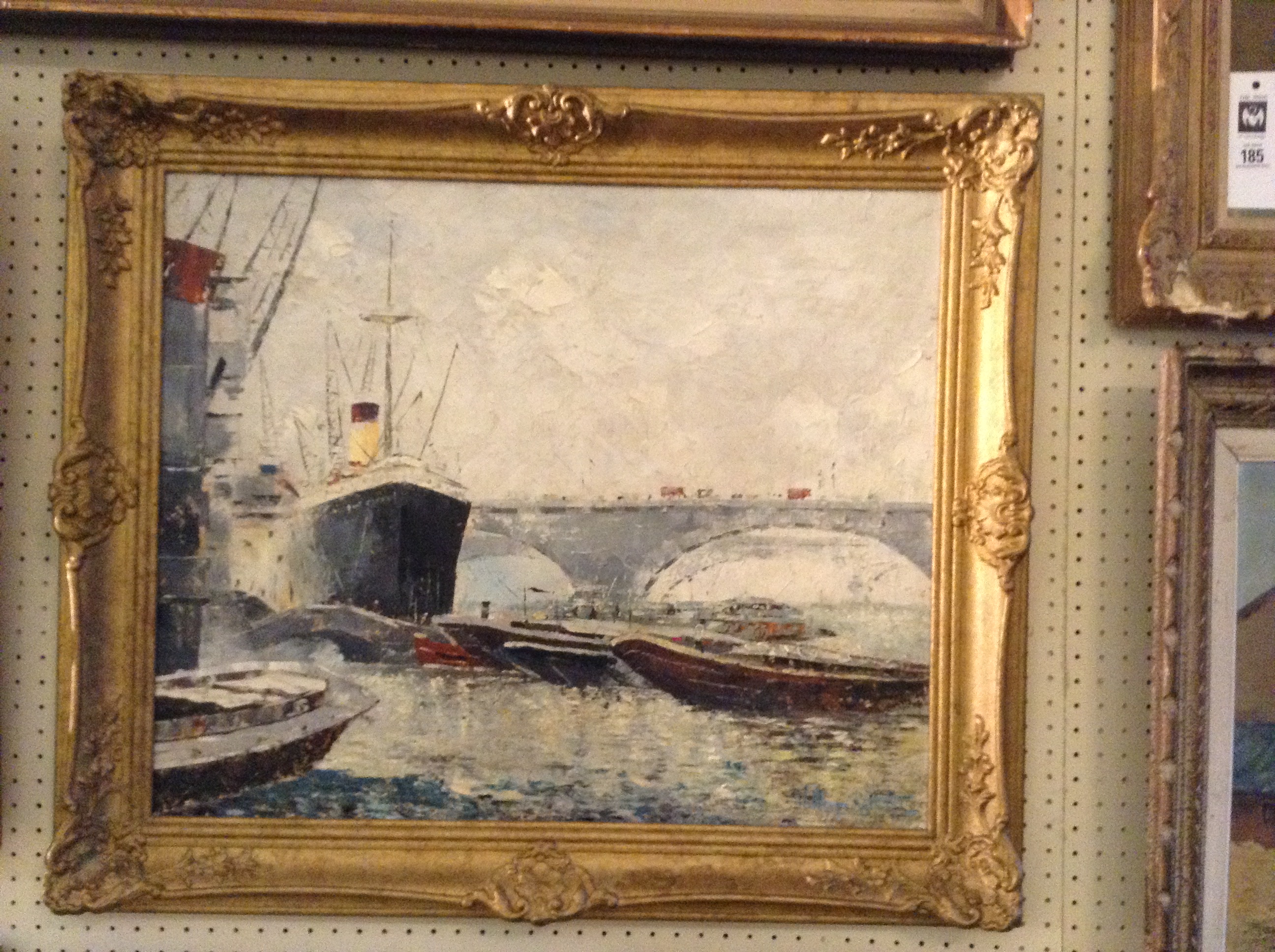 AN EARLY 20TH CENTURY OIL ON CANVASView of the Thames, indistinctly signed lower right and gilt