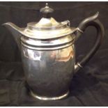 GEORGE EDWARD & SONS, GLASGOW, AN EARLY 20TH CENTURY SOLID SILVER HOT WATER JUG Having a plain