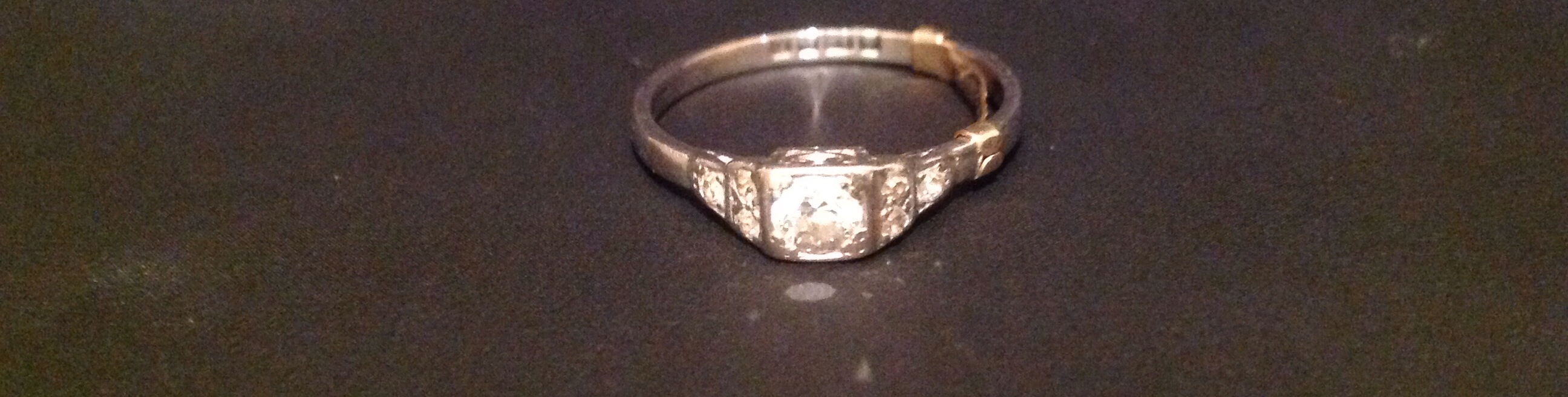 A HALLMARKED 18CT WHITE GOLD AND DIAMOND SOLITAIRE RING The central brilliant cut diamond, contained