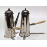 A PAIR OF EDWARDIAN HALLMARKED SILVER MINIATURE CHOCOLATE POTS Having pierced dome tops and turned