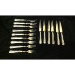 A PART SET OF CONTINENTAL SILVER FRUIT KNIVES AND FORKS Nine forks having three gilded prongs and