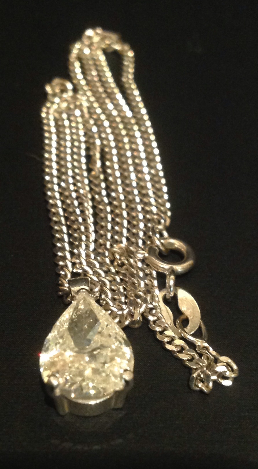 A HALLMARKED 18CT WHITE GOLD PEAR CUT DIAMOND PENDANT Claw set with a fixed bale, suspended from