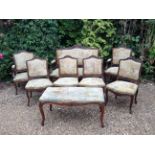 A LATE 19TH CENTURY CONTINENTAL SALON SUITE Comprising a settee, two armchairs, four standard chairs