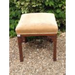 A 19TH CENTURY CHIPPENDALE REVIVAL MAHOGANY FOOT STOOL With overstuffed upholstered seat and