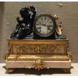 STIFFEL & CARTIER, PARIS, A 19TH CENTURY GILT AND PATINATED BRONZE MANTLE CLOCK Figured with a putti