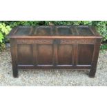 A 17TH CENTURY OAK FOUR PANELLED COFFER. (w 130cm x 70cm)