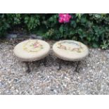 A PAIR OF MID 20TH CENTURY CIRCULAR STOOLS With needlework upholstery, raised on iron bases.