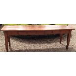 A 19TH CENTURY FRENCH FRUITWOOD DINING TABLE With two frieze drawers, raised on square legs with