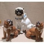 A PAIR OF 19TH CENTURY FRENCH STATUES Of seated pug dogs, along with another jar and cover formed as