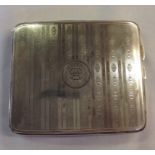 A HALLMARKED SILVER CURVED CIGARETTE CASE With engine turned design of parallel lines and initialled