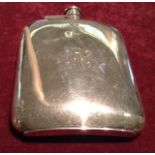 AN EARLY 20TH CENTURY HALLMARKED SILVER CURVED RECTANGULAR HIP FLASK  With a screw hinged cap and