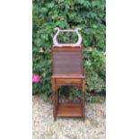 A LATE 19TH CENTURY MAHOGANY MUSIC CABINET The lyre form sheet stand above a fitted tambour front