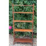 A VICTORIAN STYLE MAHOGANY SERPENTINE WHATNOT  With five graduated shelves. (h 145cm x w 77cm)