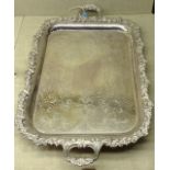 AN EARLY 20TH CENTURY SILVER PLATED RECTANGULAR SERVING TRAY With two handles and a decorative heavy