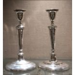 A PAIR OF QUEEN ANNE DESIGN SILVER PLATE ON COPPER CANDLESTICKS Supported on oval platform bases. (