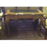 A 19TH CENTURY FRENCH WALNUT WRITING TABLE With a black leather surface above three drawers,