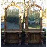 AN IMPRESSIVE AND RARE PAIR OF OAK GOTHIC DESIGN CONSOLE TABLES  The pointed arched framed mirrors