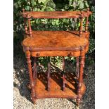 A VICTORIAN BURR WALNUT MUSIC CANTERBURY Having a single shelf and secrétaire drawer, raised on