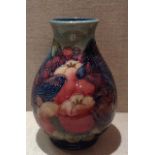 MOORCROFT, A 20TH CENTURY POTTERY VASE With tube lined decoration, depicting two Finches in an