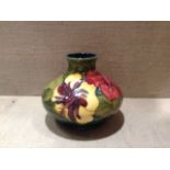 MOORCROFT, A 20TH CENTURY POTTERY VASE With tubelined decoration and a hibicus pattern, hand painted