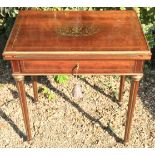 A 19TH CENTURY FRENCH MAHOGANY AND BRASS INLAID GAMES TABLE With a single drawer opening to reveal a