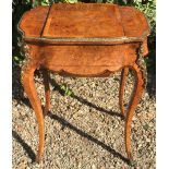 A VICTORIAN BURR WALNUT AND ORMOLU MOUNTED LADIES' EXHIBITION QUALITY WORK TABLE Opening to reveal