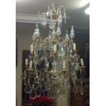 A LARGE AND IMPRESSIVE EARLY 20TH CENTURY FRENCH ORMOLU EIGHTEEN BRANCH TWELVE LIGHT CHANDELIER