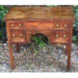 A GEORGIAN MAHOGANY LOWBOY  With a string inlaid top, over an arrangement of three drawers, raised