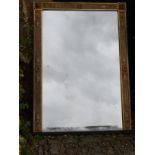 A REGENCY PERIOD GILT FRAMED OVERMANTEL MIRROR Applied with classical mouldings. (122cm x 171cm)