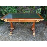 A GOOD REGENCY DESIGN WALNUT AND PARCEL GILT WRITING TABLE The green tooled leather top above a