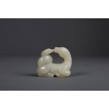 A SMALL 18th/19th CENTURY CELADON CARVING OF A GOAT AND A DUCK Carved in the form of a recumbent