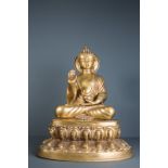 A 19th/20th CENTURY GILT BRONZE FIGURE OF SHAKYAMURI Seated on a lotus plinth with yabhayamudra