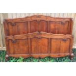 A 19TH CENTURY FRENCH WALNUT DOUBLE BEDSTEAD WITH OGEE PANELS