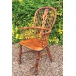 A GOOD 19TH CENTURY YEW WOOD WINDSOR CHAIR Having an elm seat and crinoline stretcher.