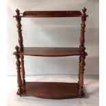 A 19TH CENTURY MAHOGANY SMALL SET OF SHELVES With turned columns.