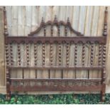 A 19TH CENTURY FRENCH WALNUT DOUBLE BEDSTEAD WITH BARLEYTWIST SPINDLE RAILS