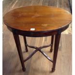 AN EARLY 20TH CENTURY MAHOGANY OVAL OCCASIONAL TABLE With reeded tapered legs and a cross stretcher.