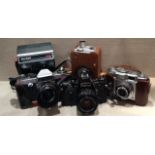 A COLLECTION OF VINTAGE CAMERAS To include Praktica Nova 1B, Canon AE-1, A Zeiss Ikon, a Brownie 8mm