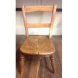 A 19TH CENTURY ELM CHILD'S OXFORD CHAIR Raised on turned legs, with a turned stretcher.  (h 56cm x