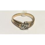 A HALLMARKED 9CT GOLD AND DIAMOND DRESS RING The two small brilliant cut diamonds claw set to a half