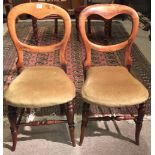 A PAIR OF 19TH CENTURY FRUITWOOD BALLOON BACK BEDROOM CHAIRS Having single splat backs and padded