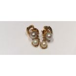 A PAIR OF 14CT GOLD AND CULTURED PEARL DROP EARRINGS Each comprises a 7mm cultured pearl, claw set