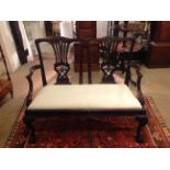 A 19TH CENTURY MAHOGANY TWO SEATER CHAIR SETTEE With a finely carved frame and pierced vase splat,