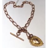 AN EARLY 20TH CENTURY HALLMARKED 9CT ROSE GOLD FOB CHAIN With T bar, dog clips and an unmarked