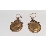 A PAIR OF 9CT GOLD MOUNTED ¼ KRUGERRAND EARRINGS Each having a ¼ Kruggerand in a scrolling mount,