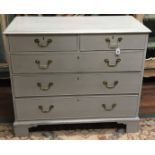 A GEORGIAN GREY PAINTED AND WAXED CHEST Of two short above three long drawers, fitted with heavy